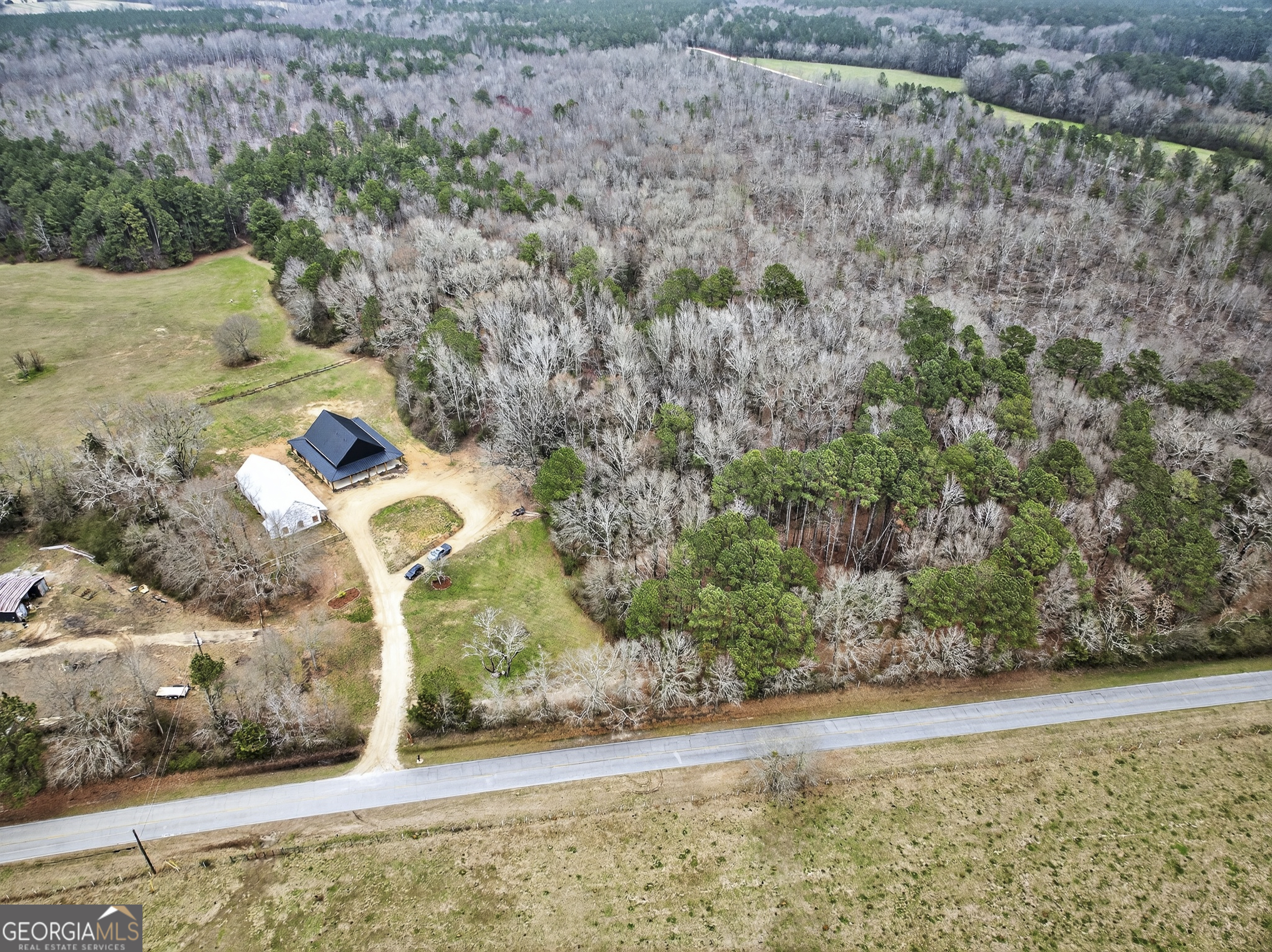 1570 Eley Road White Plains, GA 30678 - Photo 35 of 43 a front view of a house with a yard and garage