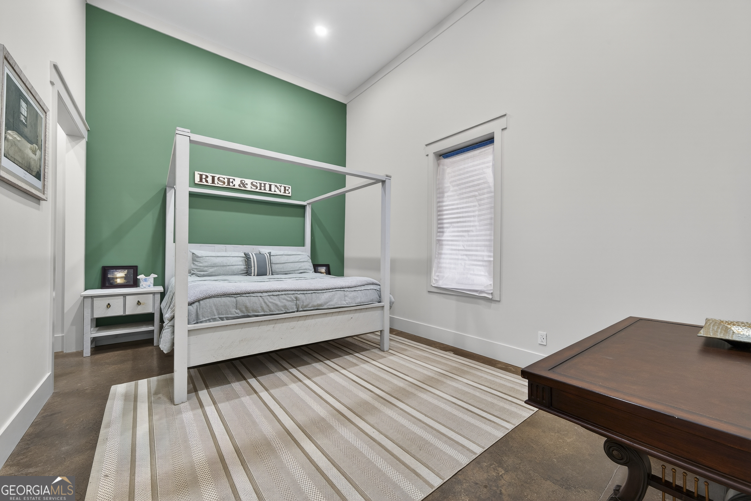 1570 Eley Road White Plains, GA 30678 - Photo 39 of 43 a bedroom with a bed and a desk