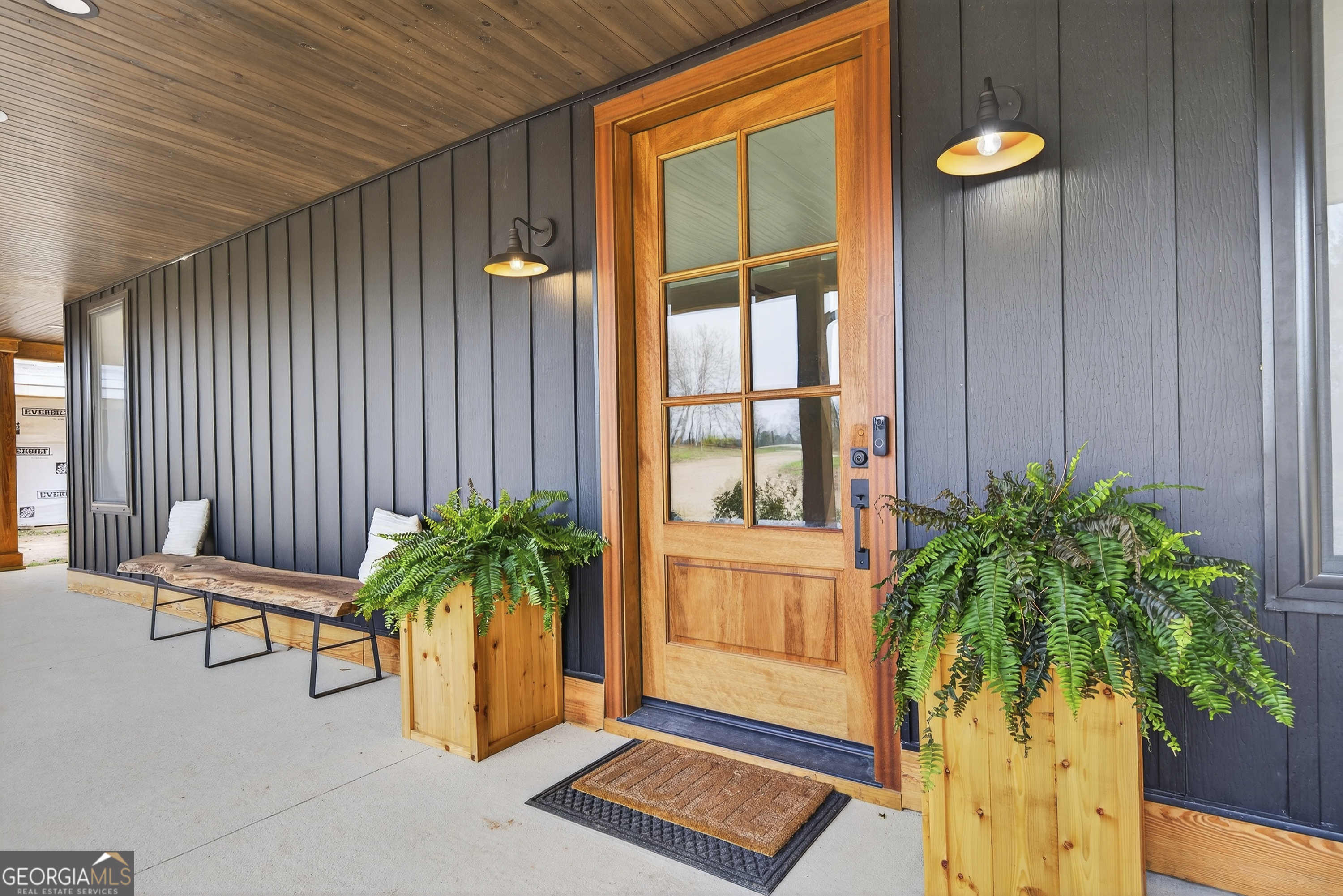 1570 Eley Road White Plains, GA 30678 - Photo 41 of 43 a potted plant sitting in front of a house