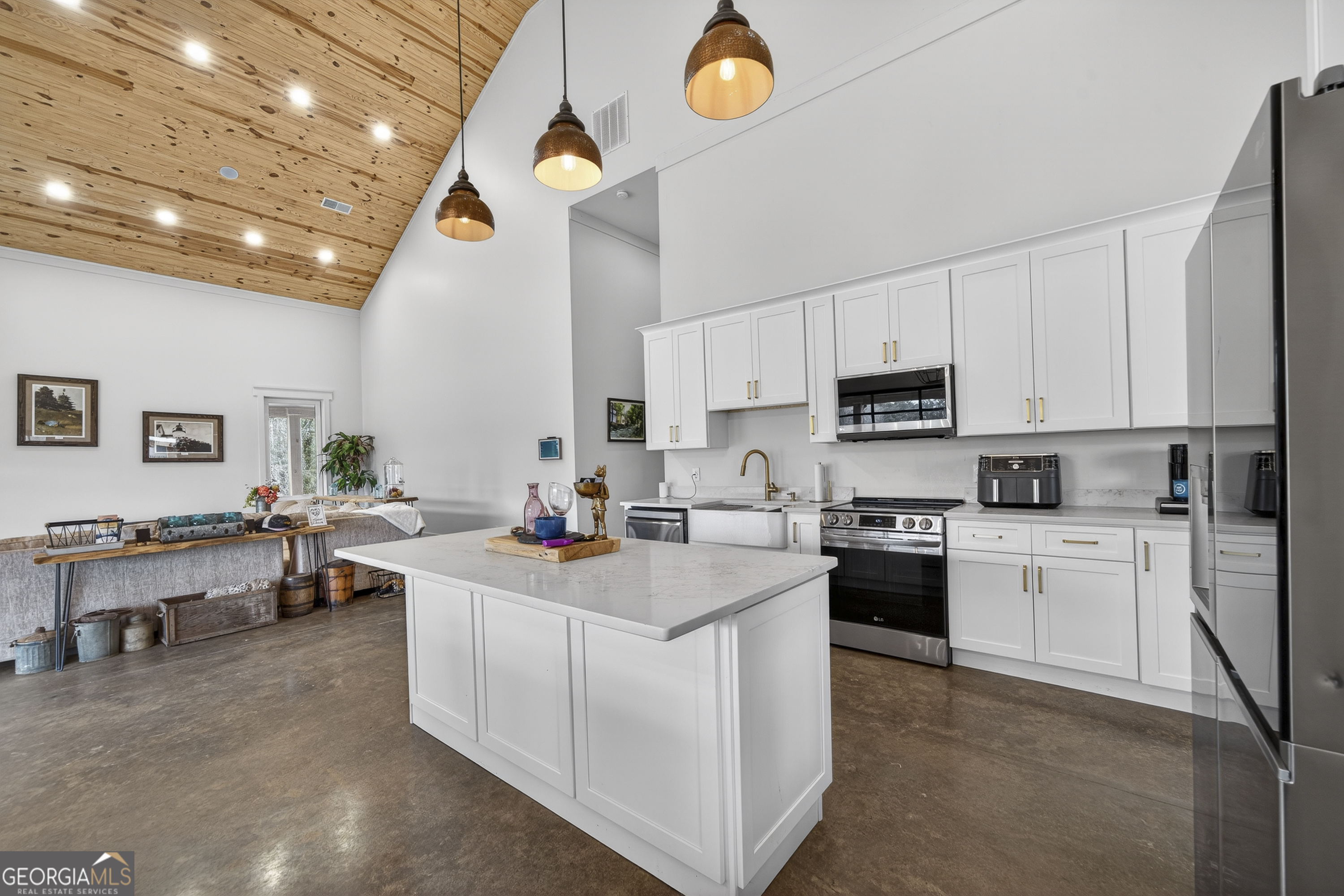1570 Eley Road White Plains, GA 30678 - Photo 5 of 43 a kitchen that has a lot of cabinets in it and appliances