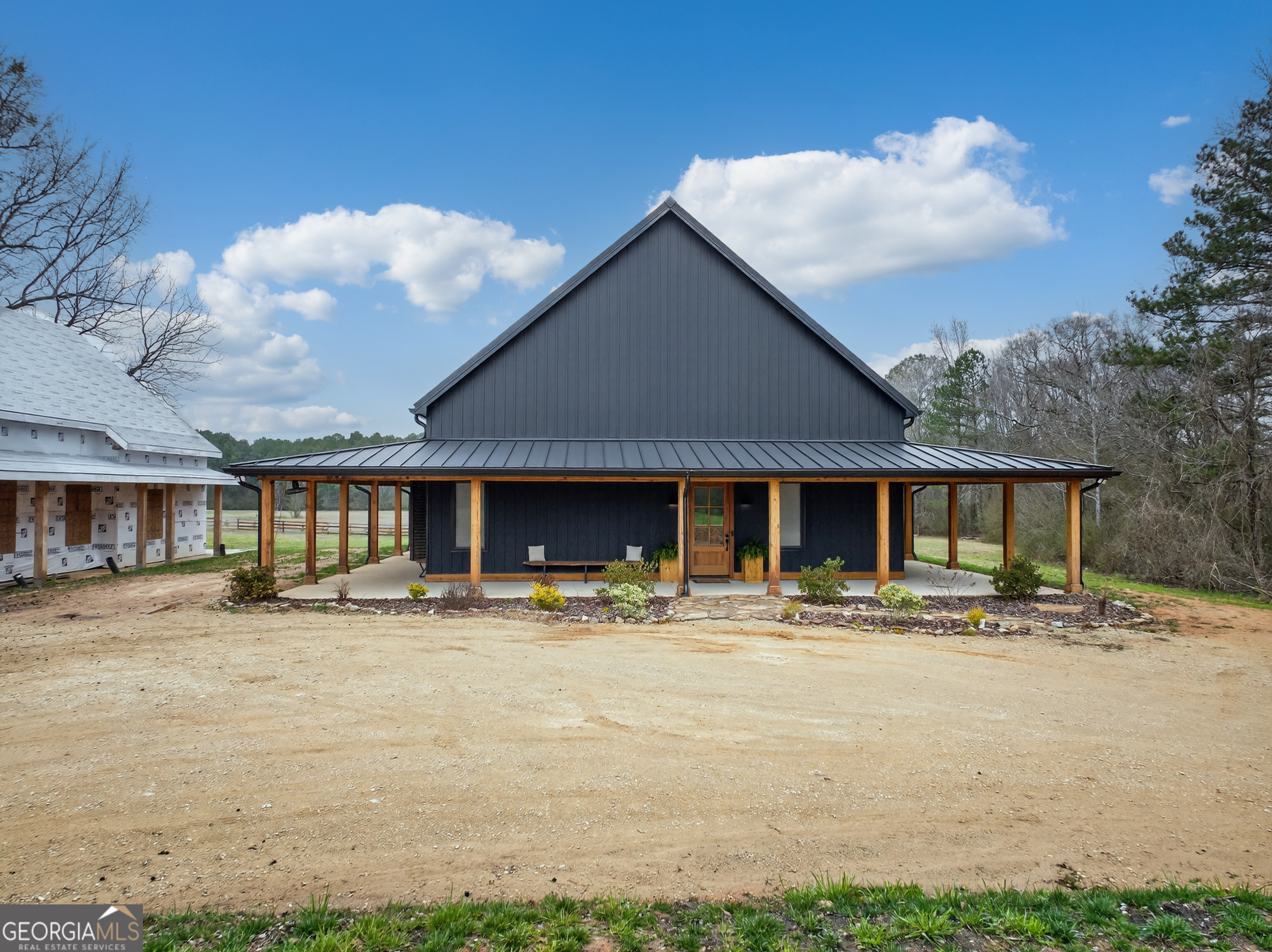 1570 Eley Road White Plains, GA 30678 - Photo 9 of 43 a front view of a house with a patio