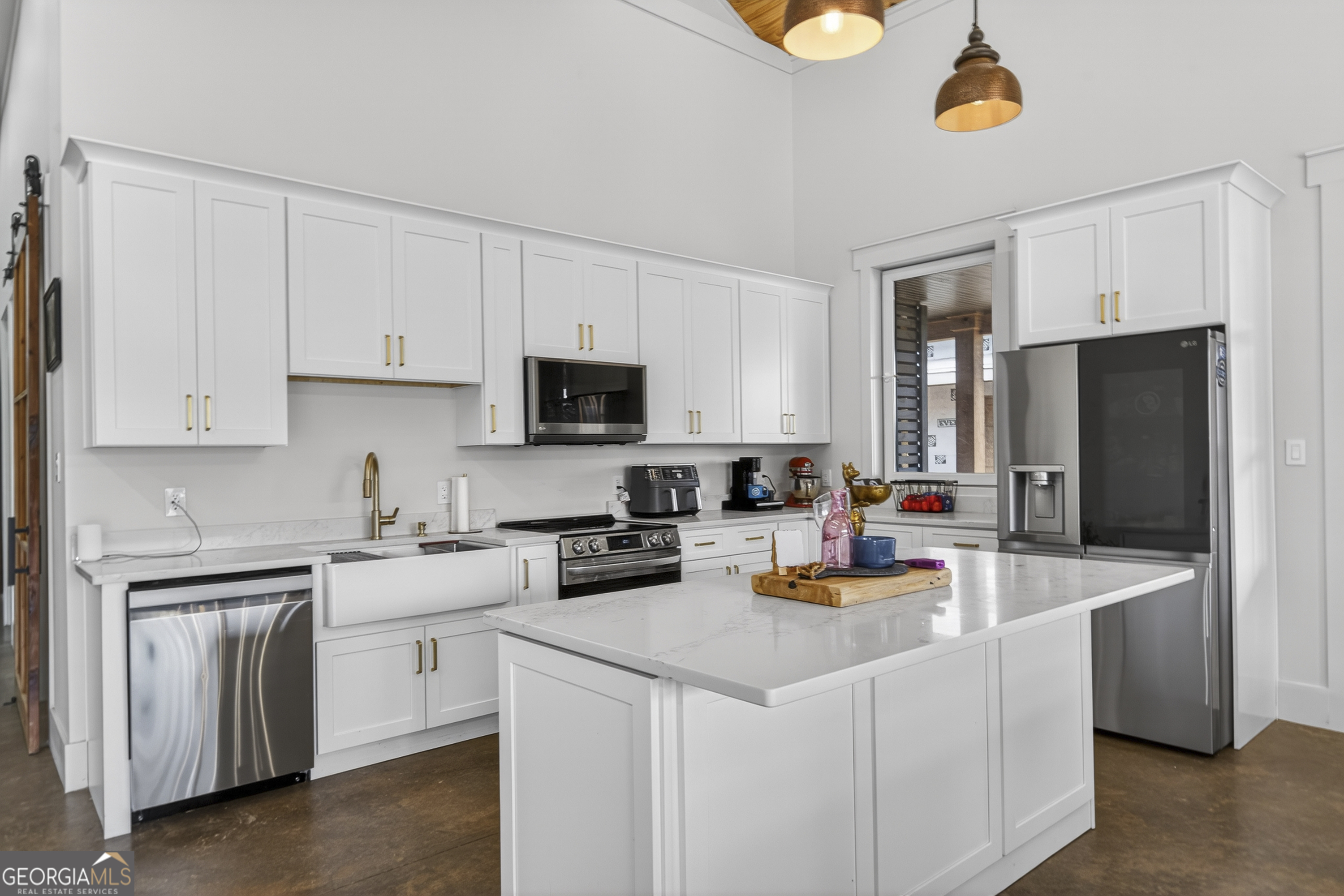 1570 Eley Road White Plains, GA 30678 - Photo 10 of 43 a kitchen with appliances a sink cabinets and a counter top space