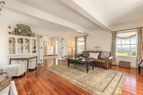 a view of a dining room with furniture window and wooden floor