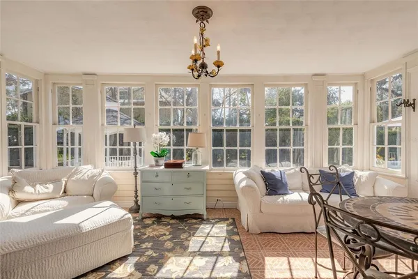 a dining room with furniture window wooden floor