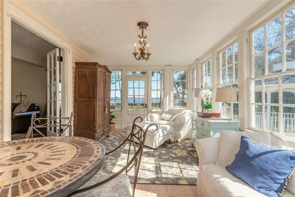 a large kitchen with stainless steel appliances kitchen island granite countertop a refrigerator and stove top oven