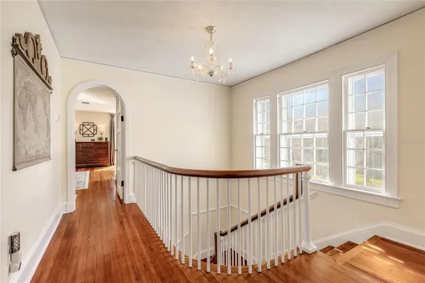 a view of a room with a mirror and a rug