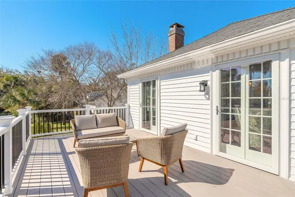 a view of a house with swimming pool and sitting area