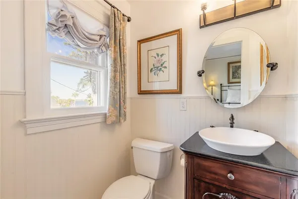 an aerial view of lake residential house with outdoor space and trees all around