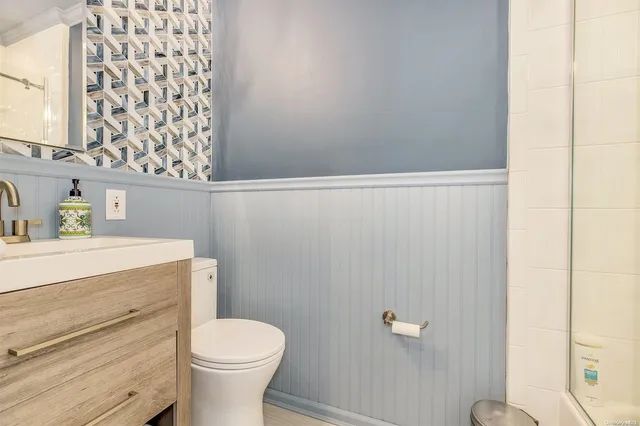 a bathroom with a toilet and a sink