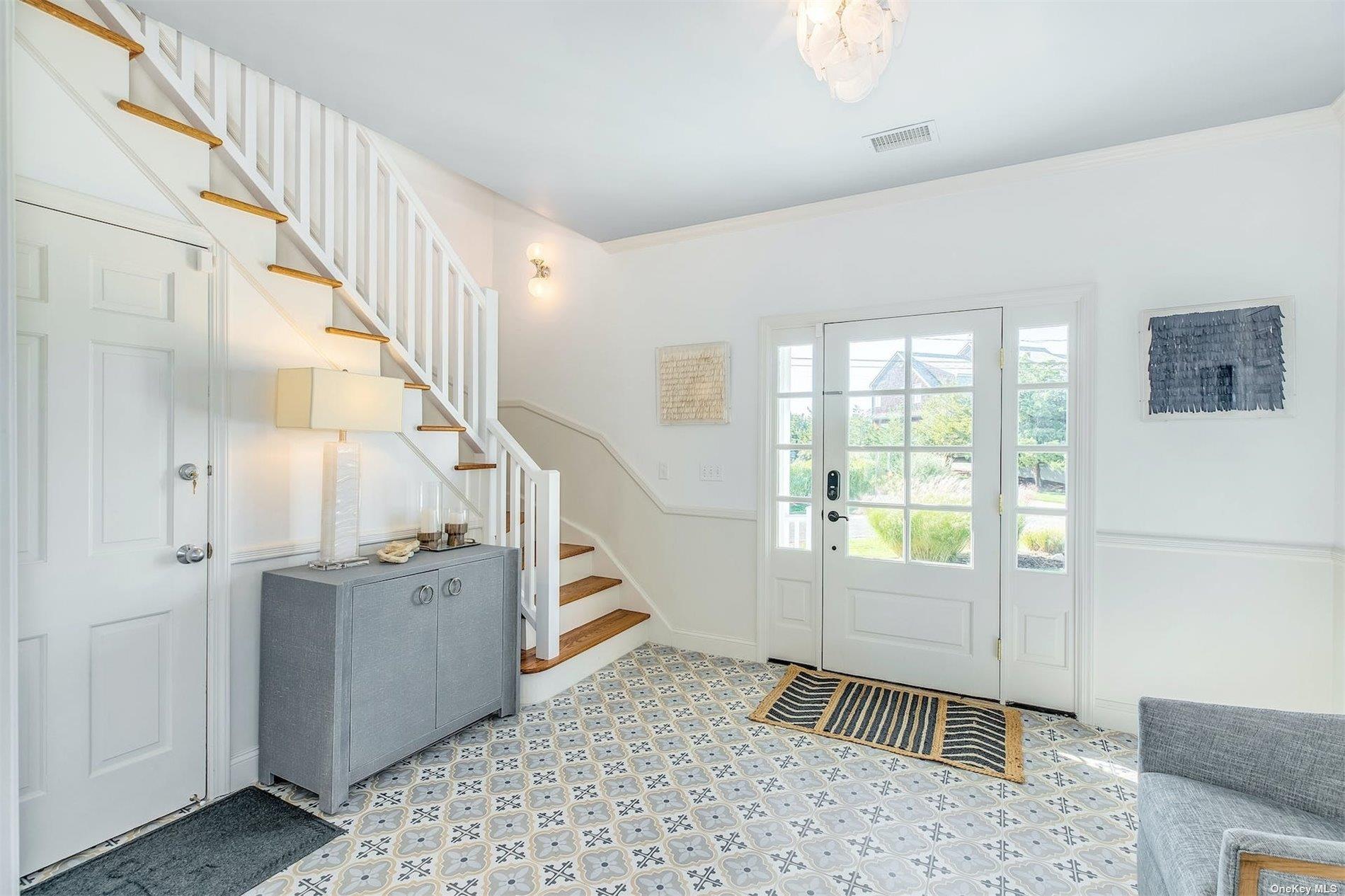 25 Exchange Westhampton Beach, NY 11978 - Photo 14 of 31 a view of entryway with livingroom and stairs