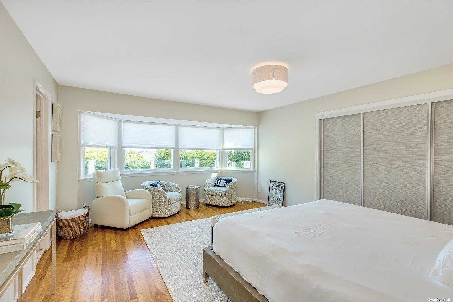 25 Exchange Westhampton Beach, NY 11978 - Photo 20 of 31 a bed room with two beds and a large window