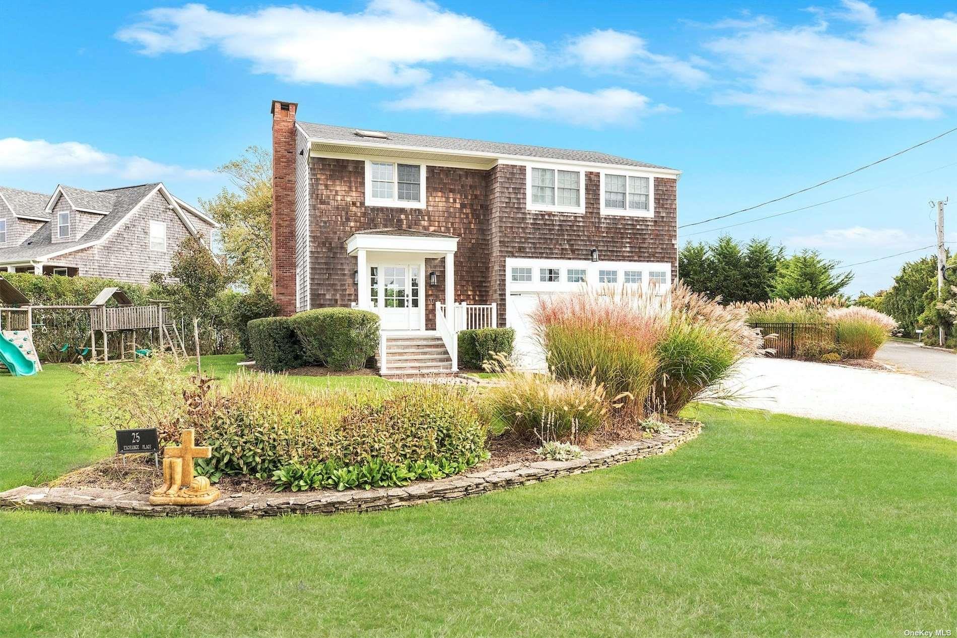 25 Exchange Westhampton Beach, NY 11978 - Photo 3 of 31 a front view of a house with a yard