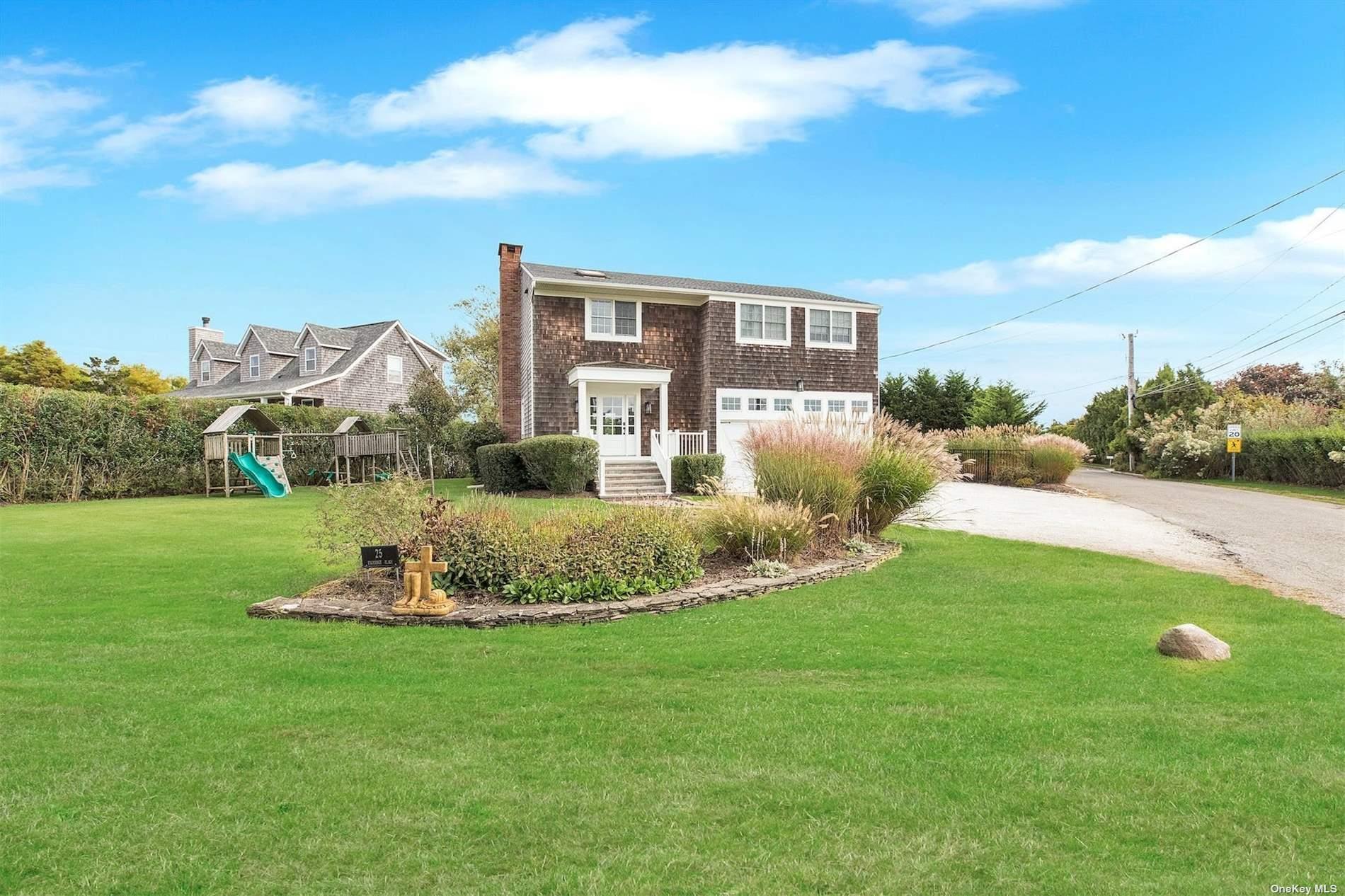 25 Exchange Westhampton Beach, NY 11978 - Photo 4 of 31 a front view of a house with a yard