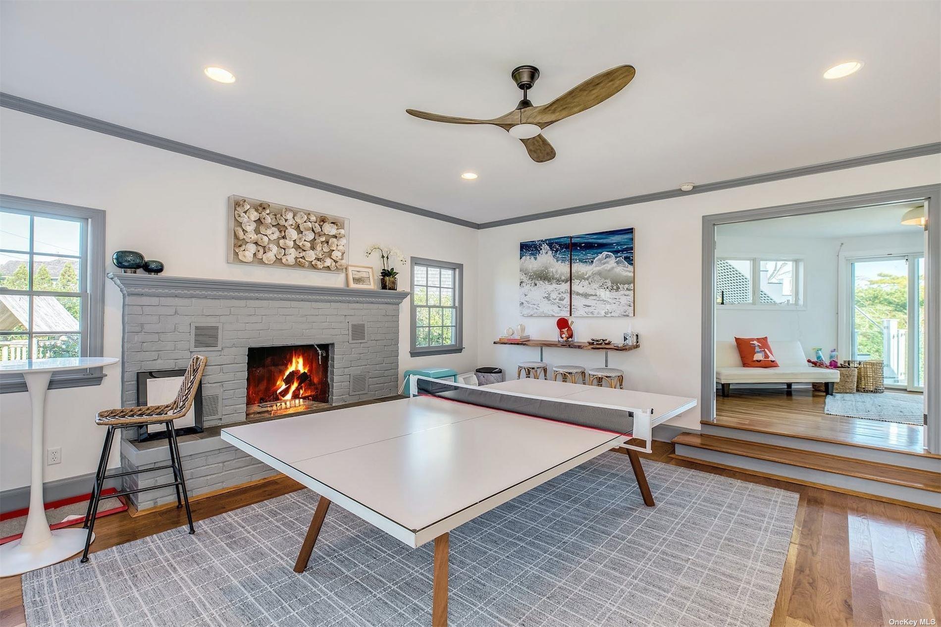 25 Exchange Westhampton Beach, NY 11978 - Photo 7 of 31 a living room with furniture and a fireplace