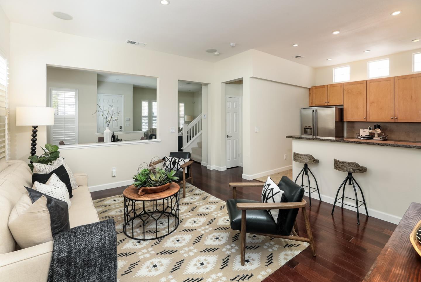 555 Front Lane Mountain View, CA 94041 - Photo 11 of 31 a living room with furniture a dining table and a potted plant