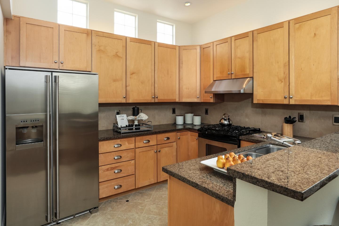 555 Front Lane Mountain View, CA 94041 - Photo 14 of 31 a kitchen with stainless steel appliances granite countertop a refrigerator sink and cabinets