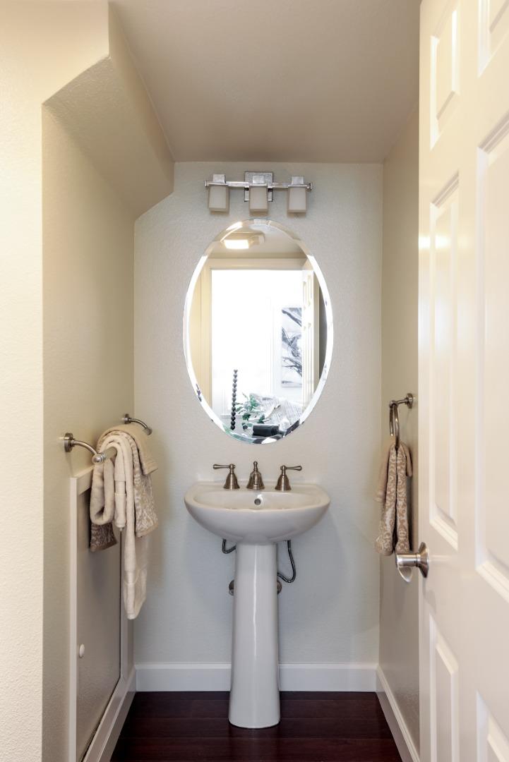 555 Front Lane Mountain View, CA 94041 - Photo 15 of 31 a bathroom with a sink and mirror