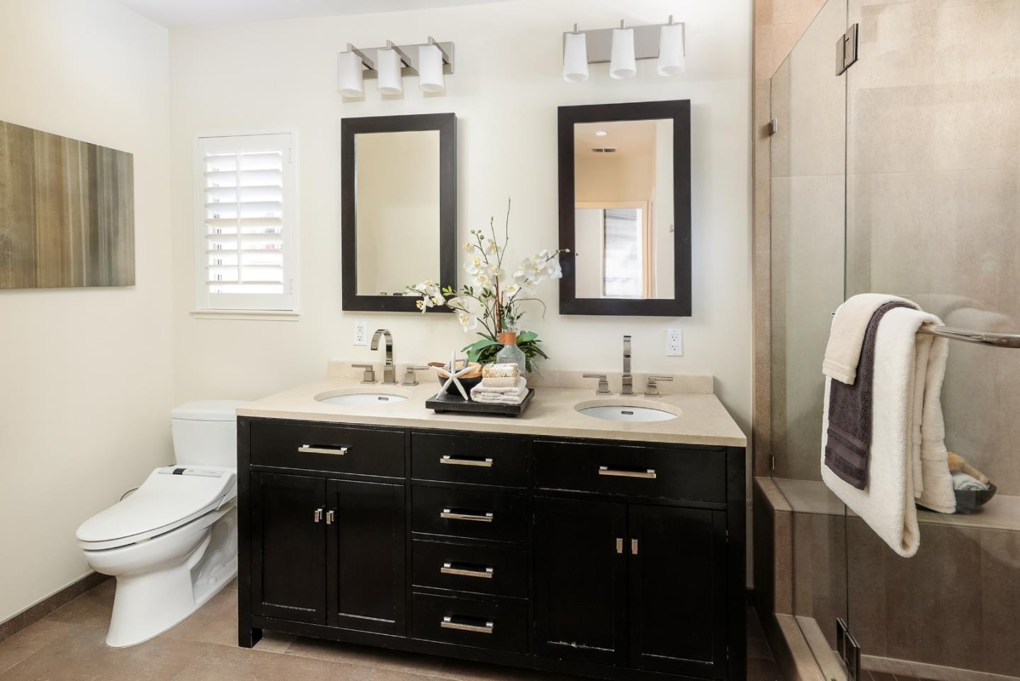 555 Front Lane Mountain View, CA 94041 - Photo 18 of 31 a bathroom with a double vanity sink toilet and a mirror