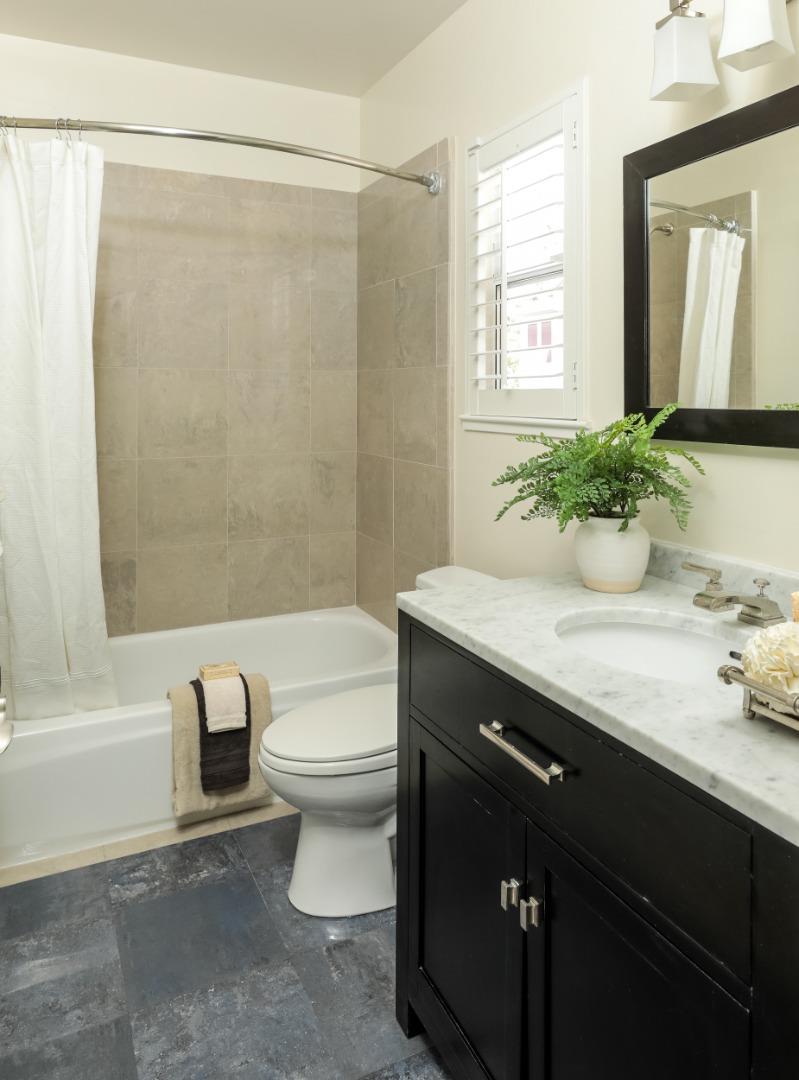 555 Front Lane Mountain View, CA 94041 - Photo 25 of 31 a bathroom with a granite countertop sink toilet and shower