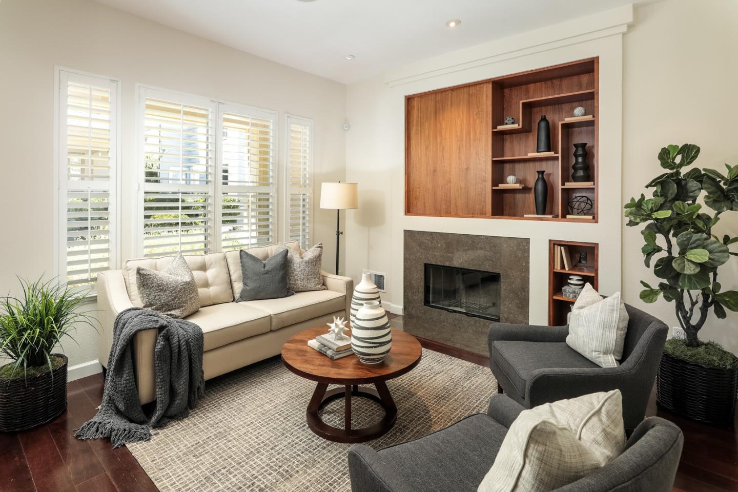 555 Front Lane Mountain View, CA 94041 - Photo 6 of 31 a living room with furniture potted plant and a fireplace