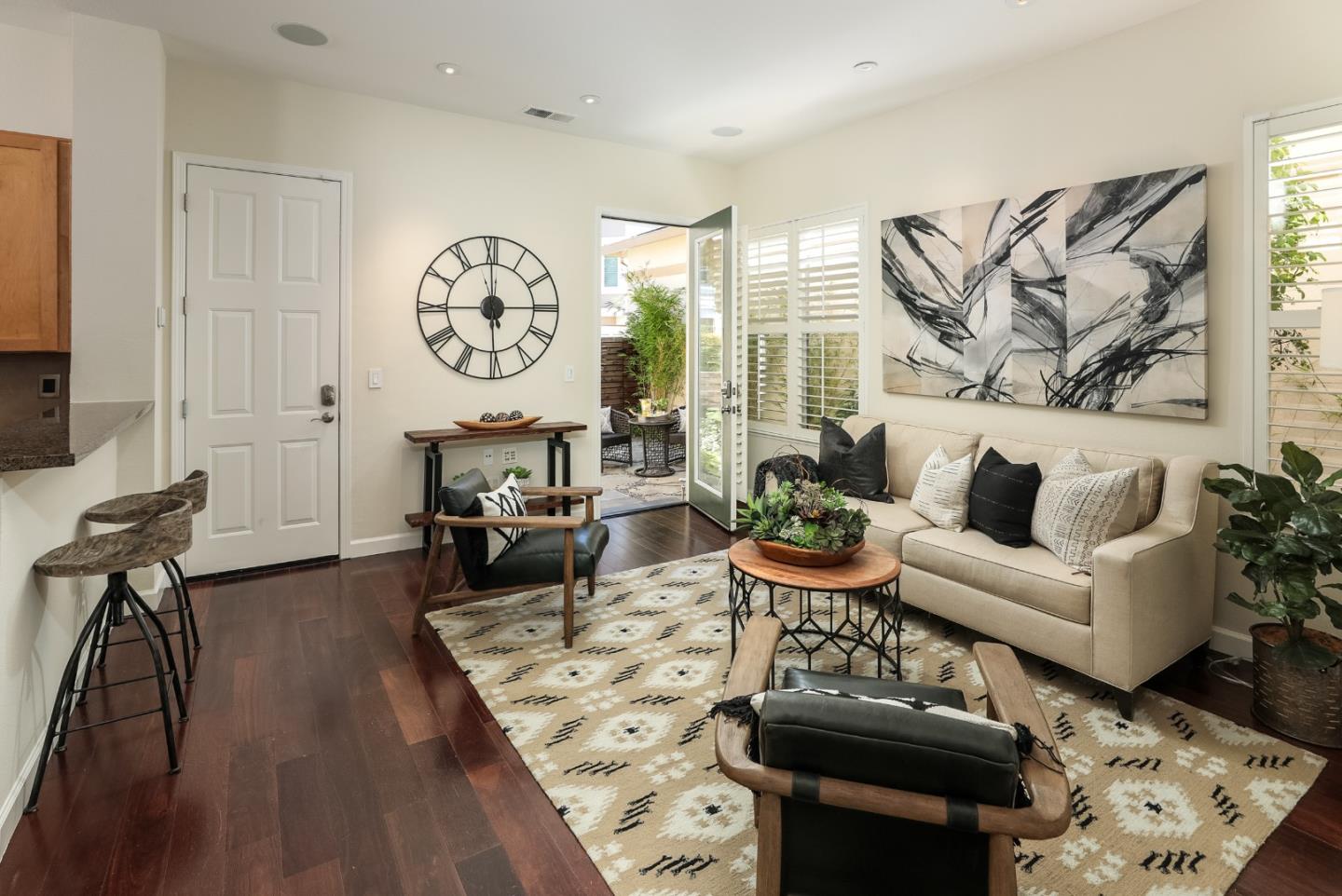 555 Front Lane Mountain View, CA 94041 - Photo 10 of 31 a living room with furniture a rug and a wall painting