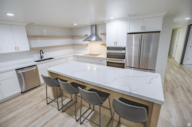 126 North 800 West Mapleton, UT 84664 - Photo 53 of 79 Kitchen with light stone countertops, stainless steel appliances, white cabinets, light wood finished floors, and recessed lighting