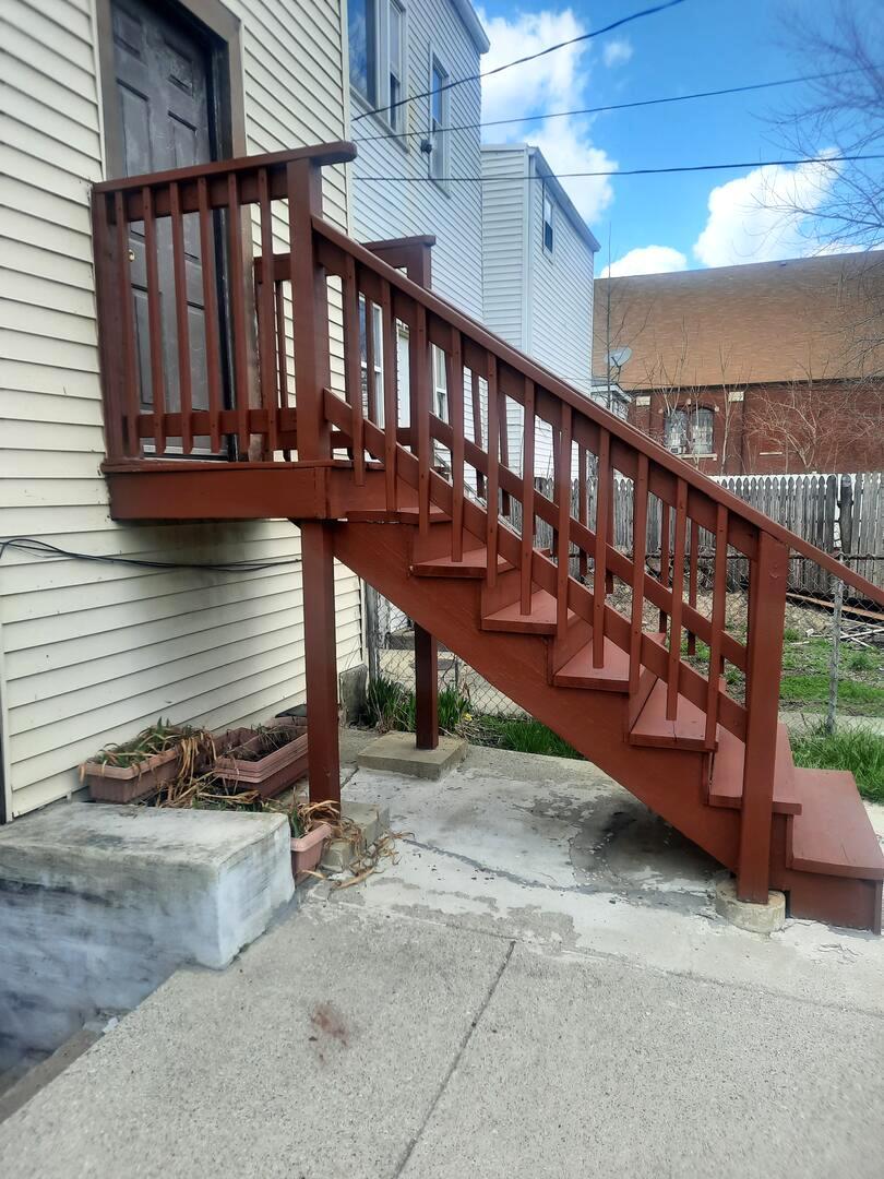 6221 South Laflin Street, Unit 2 Chicago, IL 60636 - Photo 18 of 20 a view of a balcony with wooden floor