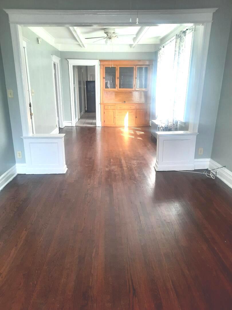 6221 South Laflin Street, Unit 2 Chicago, IL 60636 - Photo 3 of 20 a view of an empty room with wooden floor and a window