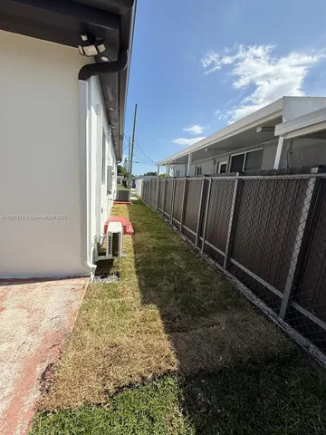 a backyard of a house with lots of green space