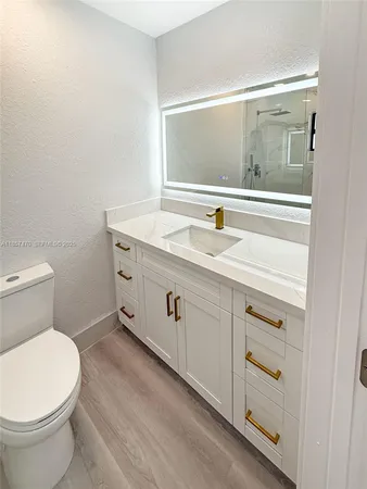 a bathroom with a shower and a toilet