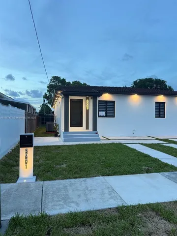 a backyard of a house with lots of green space
