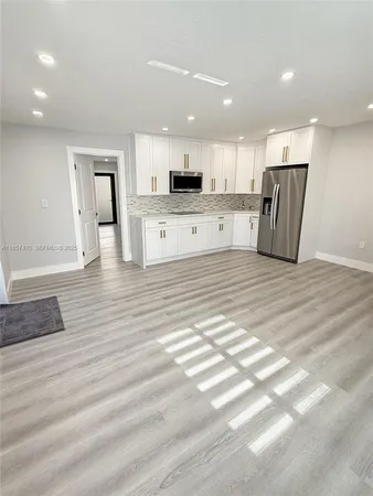 a view of a kitchen with a sink