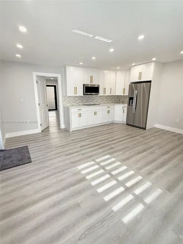 a view of a kitchen with a sink
