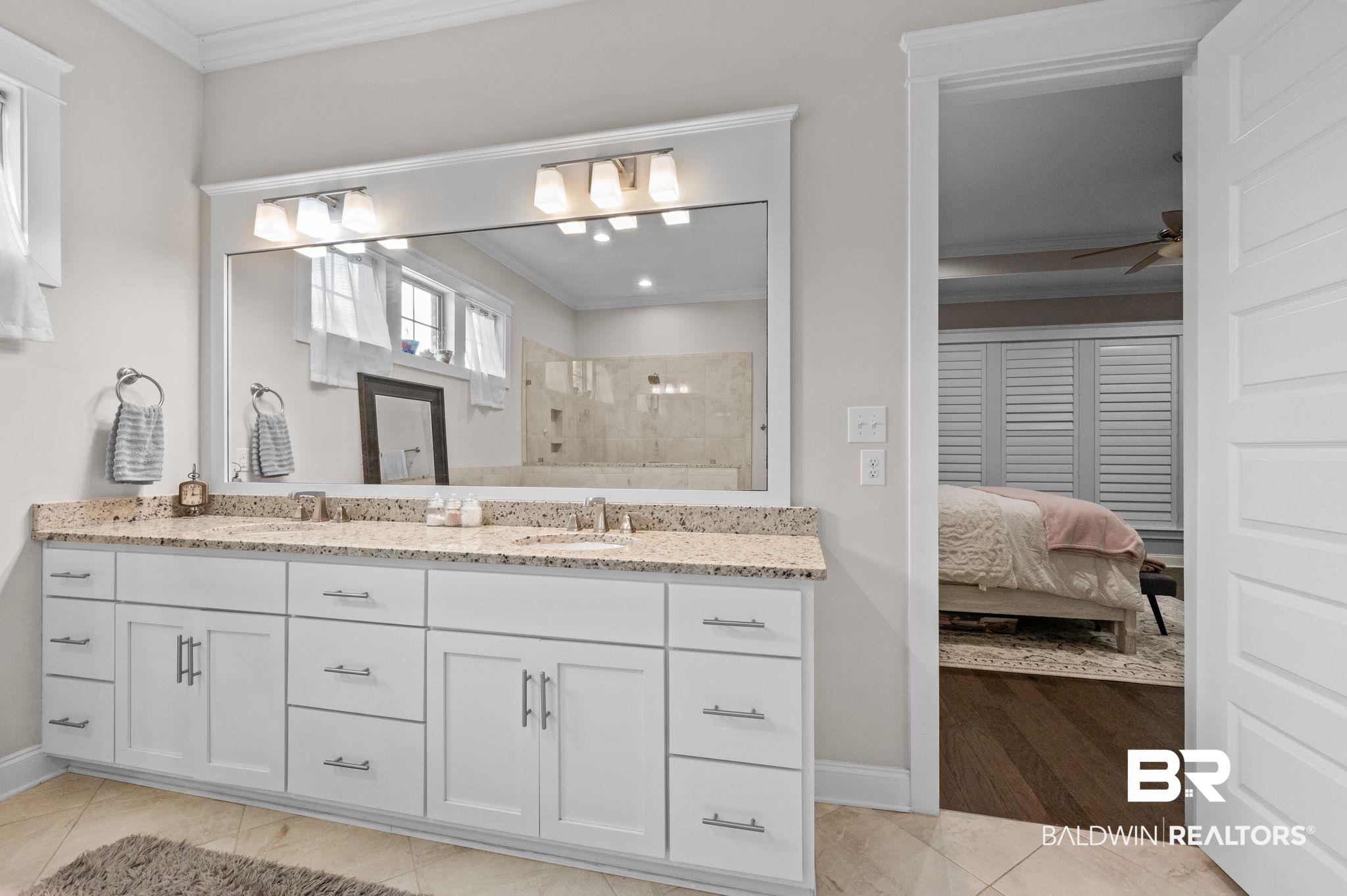 32194 Badger Court Daphne, AL 36527 - Photo 31 of 49 Ensuite bathroom featuring ornamental molding, double vanity, a tile shower, ceiling fan, and light tile patterned floors