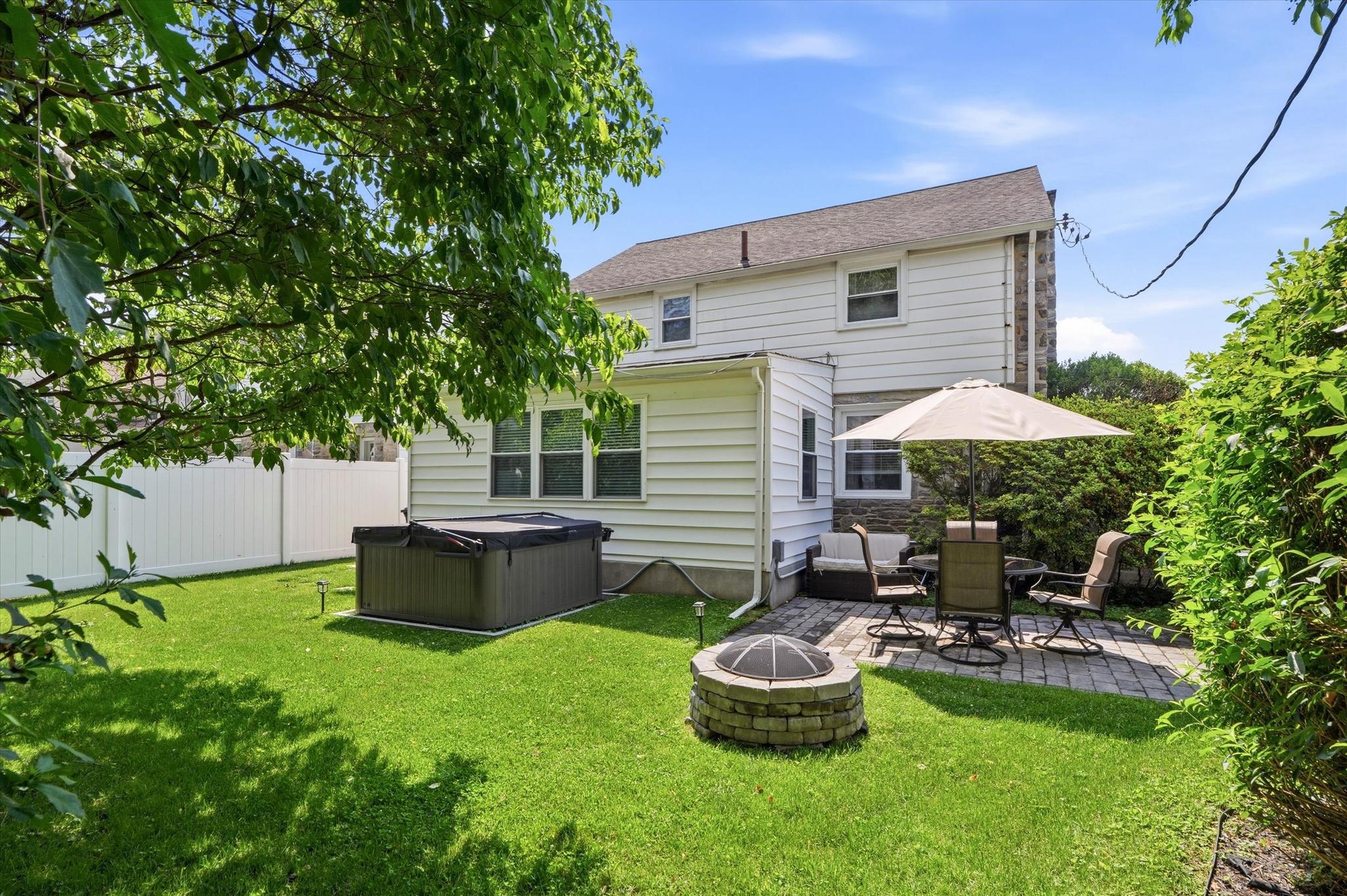 408 Maplewood Road Springfield, PA 19064 - Photo 20 of 24 Back yard with fire pit patio with pavers, hot tub