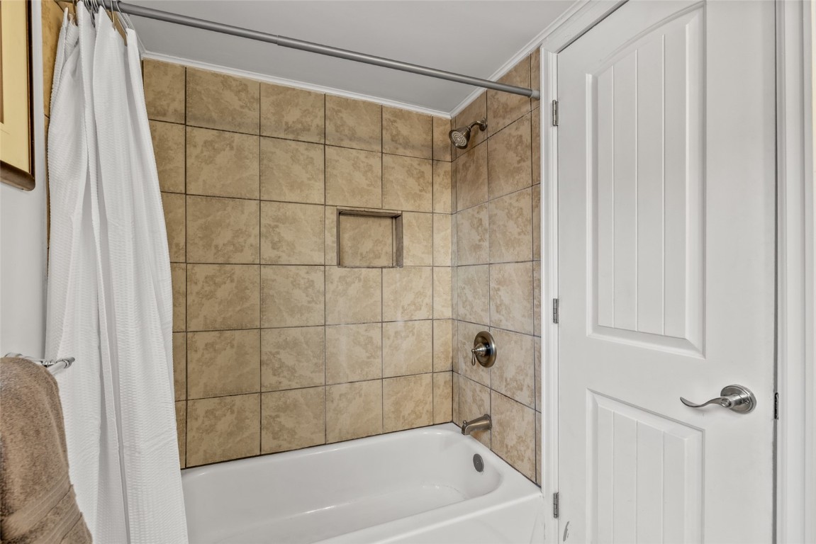 1565 Shadow Run Frontage, Unit B103 Steamboat Springs, CO 80487 - Photo 16 of 28 a bathroom with a shower and a bathtub