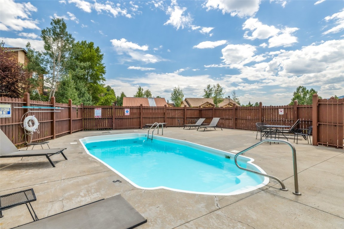 1565 Shadow Run Frontage, Unit B103 Steamboat Springs, CO 80487 - Photo 23 of 28 a view of a swimming pool with seating space