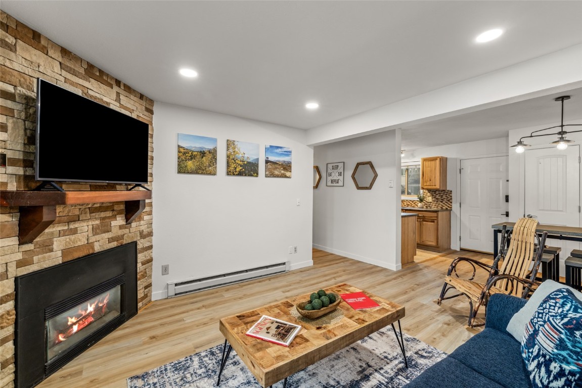 1565 Shadow Run Frontage, Unit B103 Steamboat Springs, CO 80487 - Photo 4 of 28 a living room with furniture and a flat screen tv