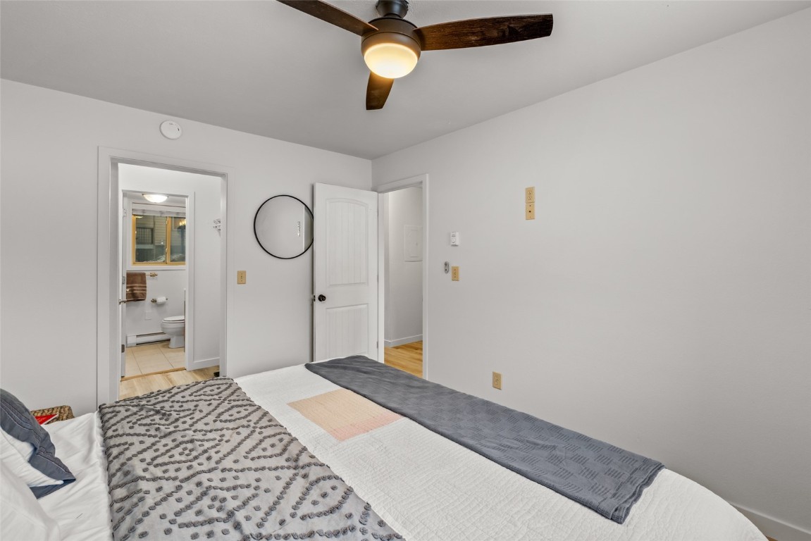 1565 Shadow Run Frontage, Unit B103 Steamboat Springs, CO 80487 - Photo 9 of 28 a bedroom with a bed and a cabinets