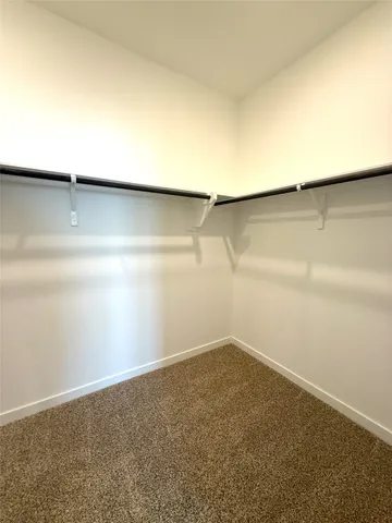 a view of a small space with wooden floor