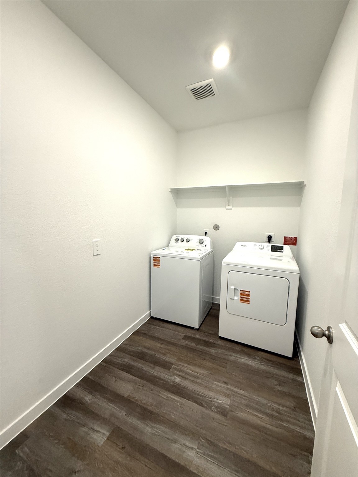 4308 Wallace Falls Lane Conroe, TX 77303 - Photo 13 of 27 a utility room with dryer and washer