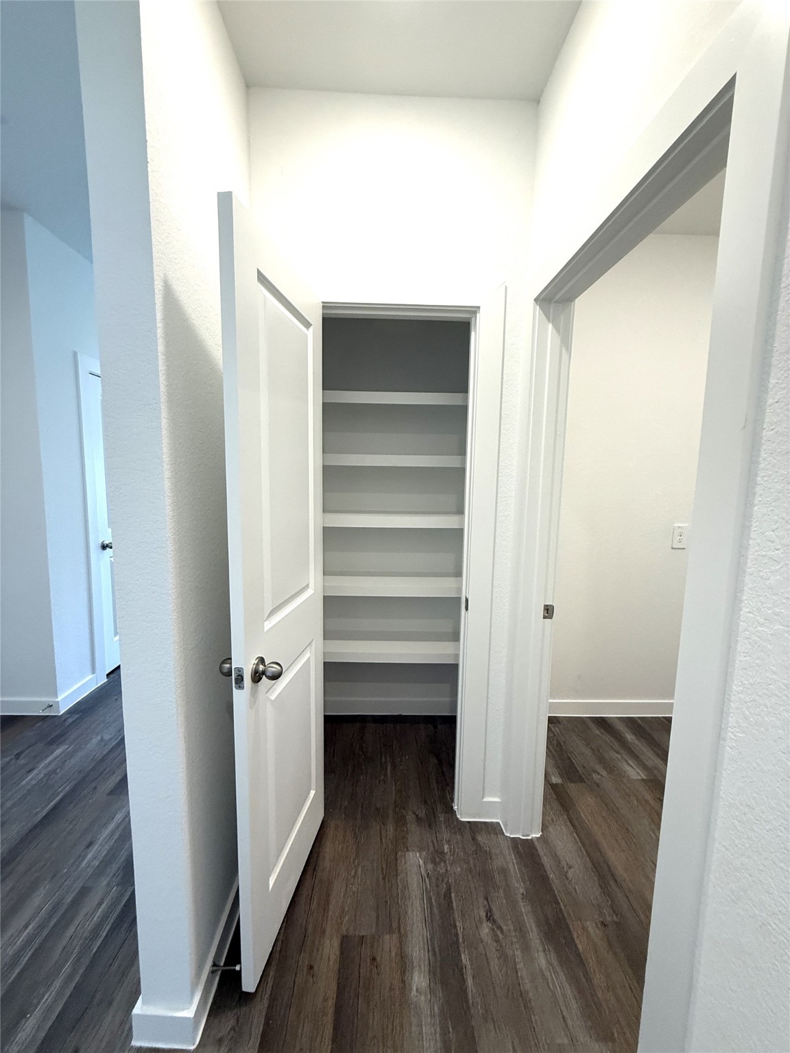 4308 Wallace Falls Lane Conroe, TX 77303 - Photo 14 of 27 a view of walk in closet with wooden floor