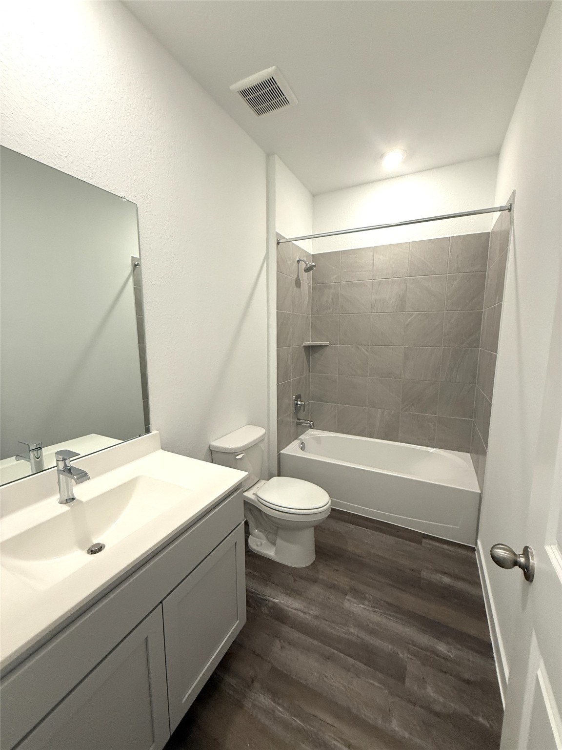 4308 Wallace Falls Lane Conroe, TX 77303 - Photo 16 of 27 a bathroom with a sink a toilet and shower