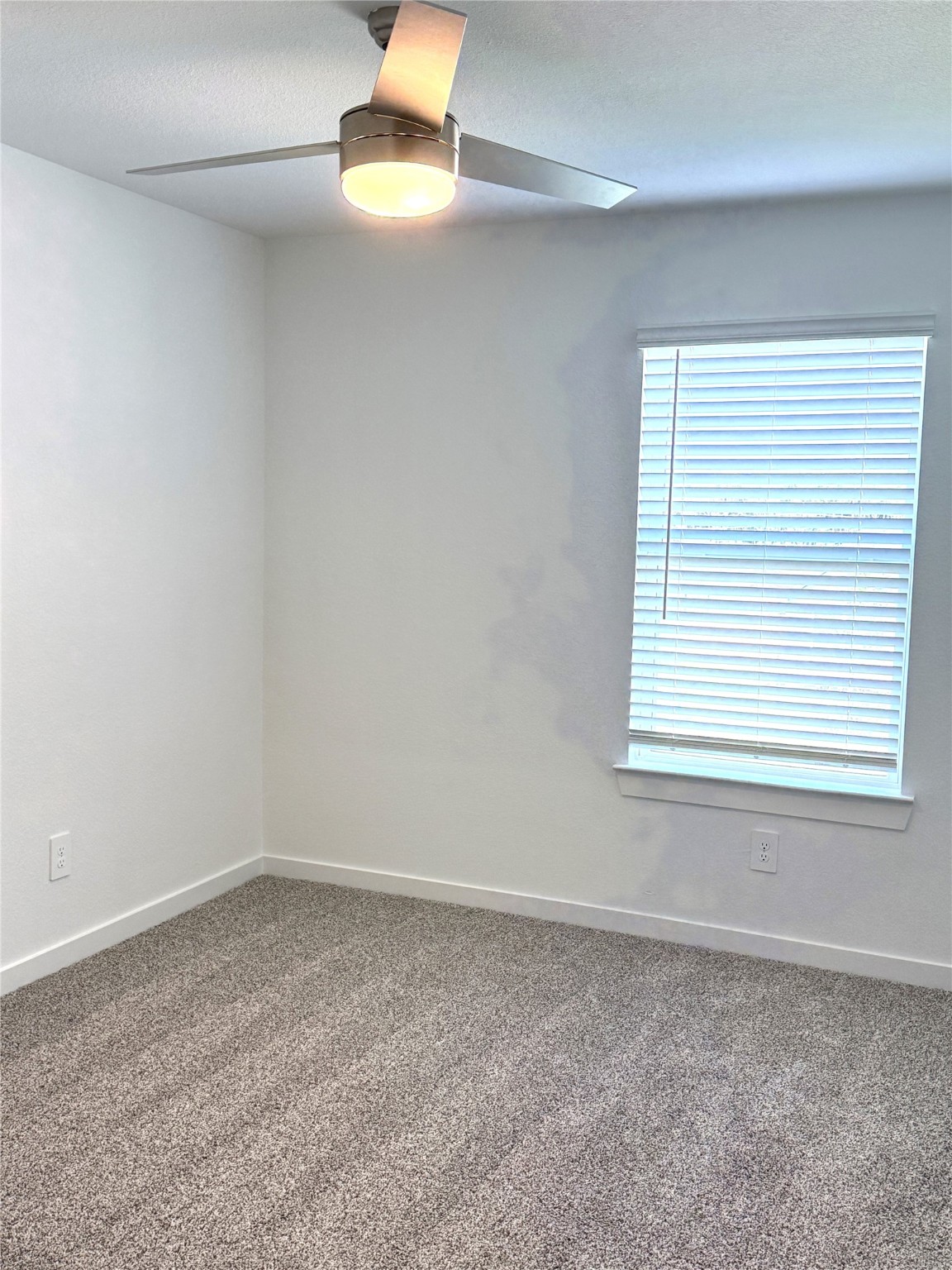 4308 Wallace Falls Lane Conroe, TX 77303 - Photo 19 of 27 an empty room with a window