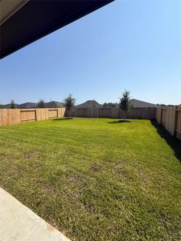 a view of a large pool with an ocean view