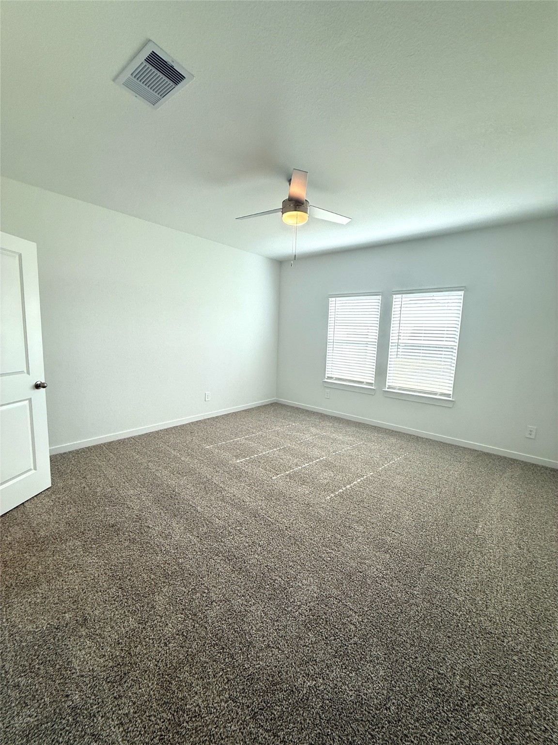 4308 Wallace Falls Lane Conroe, TX 77303 - Photo 6 of 27 an empty room with a window