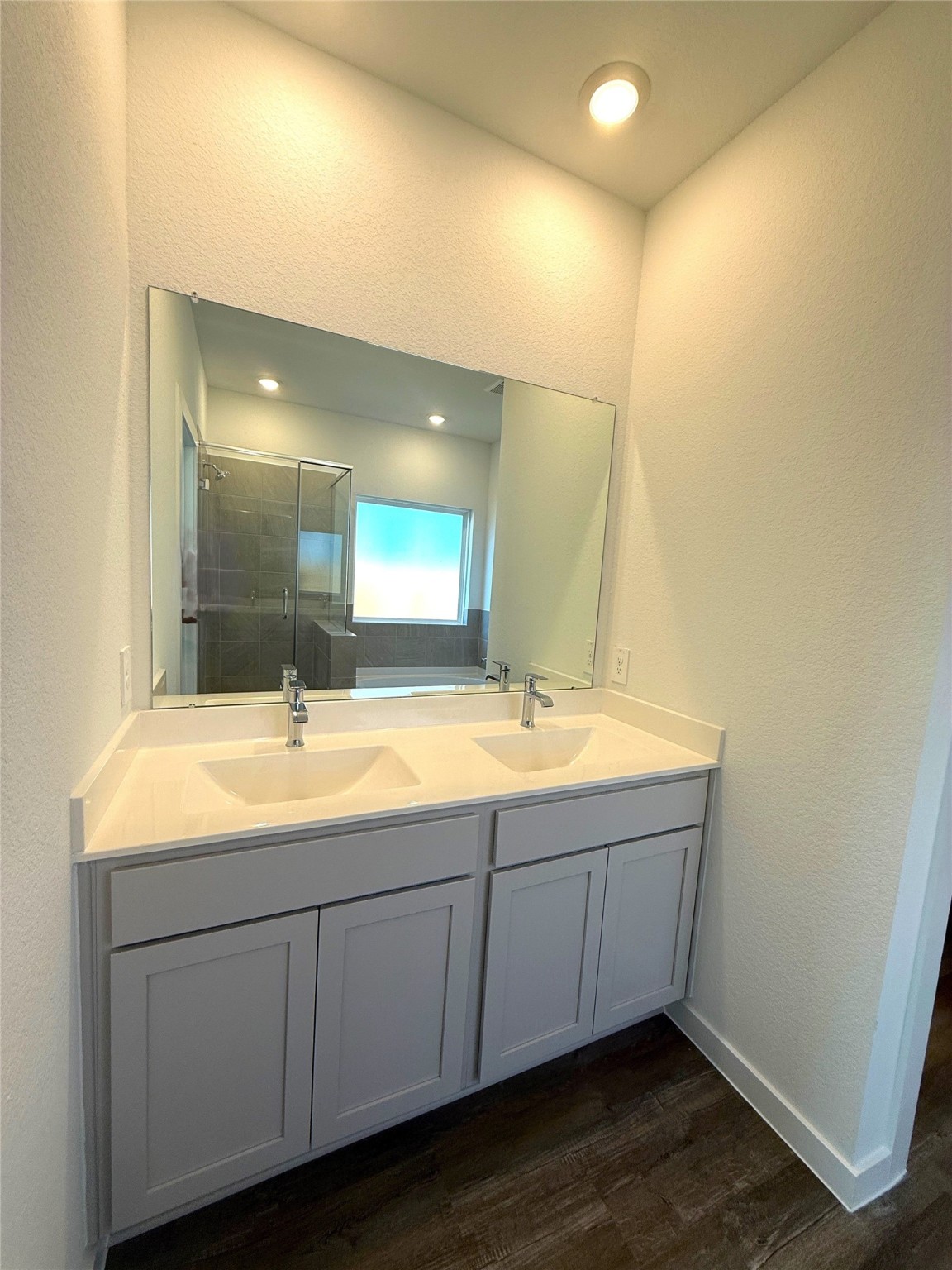 4308 Wallace Falls Lane Conroe, TX 77303 - Photo 8 of 27 a bathroom with a double vanity sink and mirror