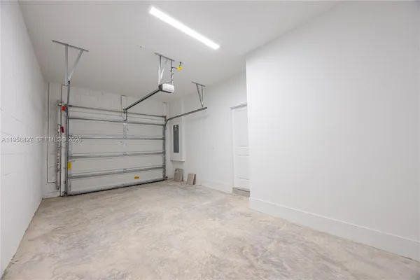 a view of room that has a white walls