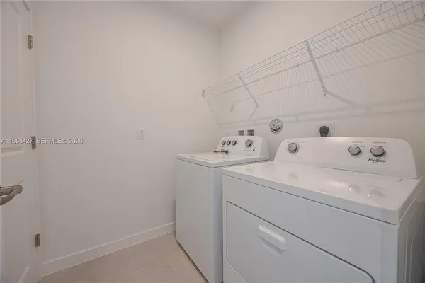 a utility room with dryer and washer