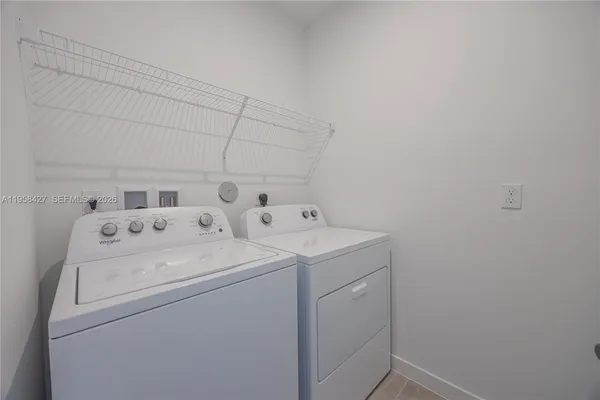 a utility room with dryer and washer